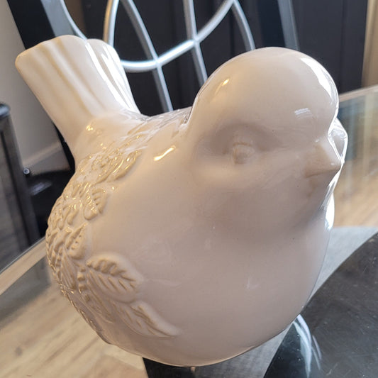 White ceramic bird statue