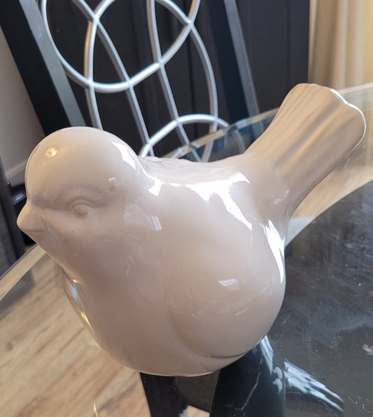 White ceramic bird statue